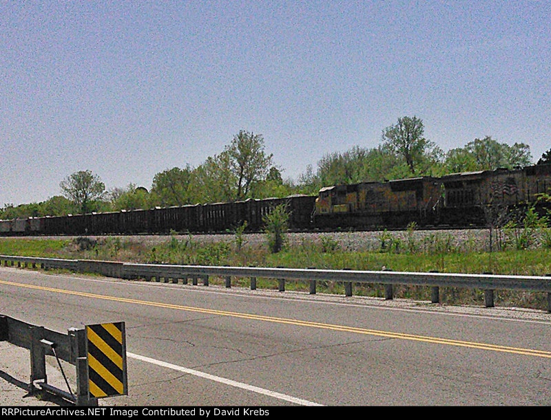 NB ballast train eases uphill to a stop.